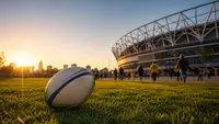 Rugby ball outside a stadium at sunset